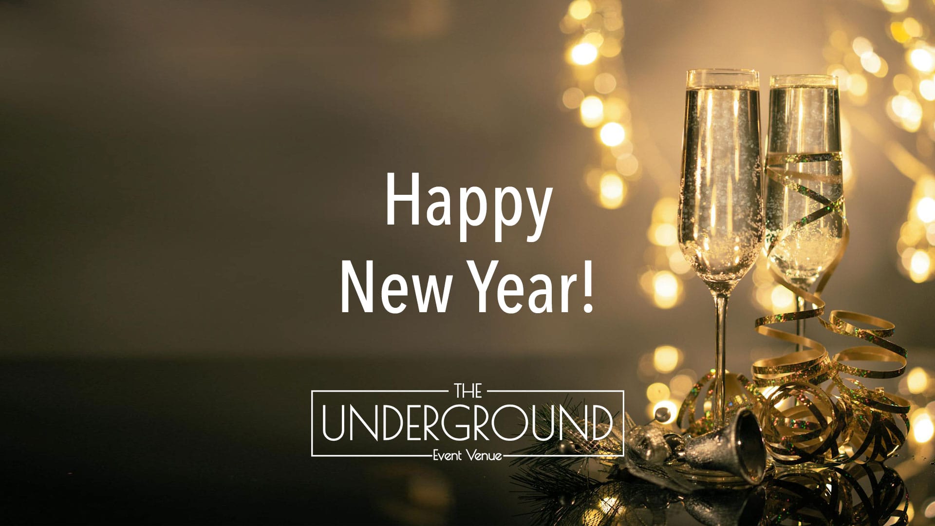 Midnight New Year’s celebration at The Underground Event Venue in Flat Rock, Michigan, with sparkling lights and festive decorations.