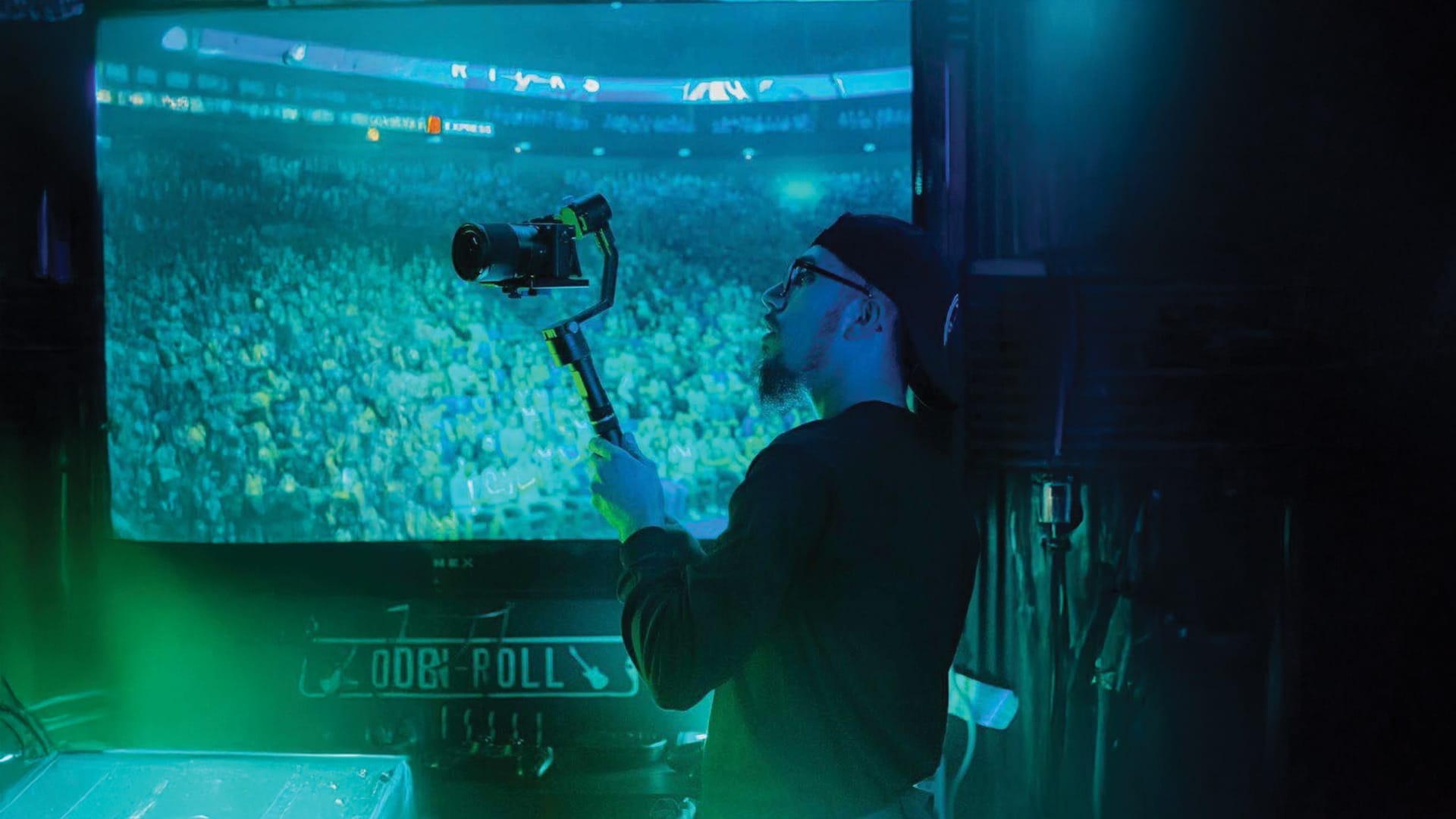 Stelios Stylianou capturing moments at a live event with his camera, showcasing his expertise in photography and videography.